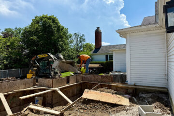 Pouring concrete for foundation walls at our project in Northfield - Home Builders News 7179
